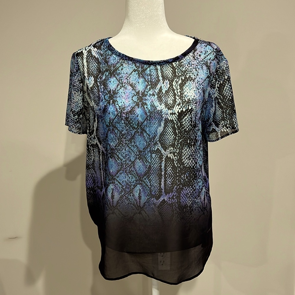 Lavender Brown, size Larger.  Sheer layer with a camisole underneath.